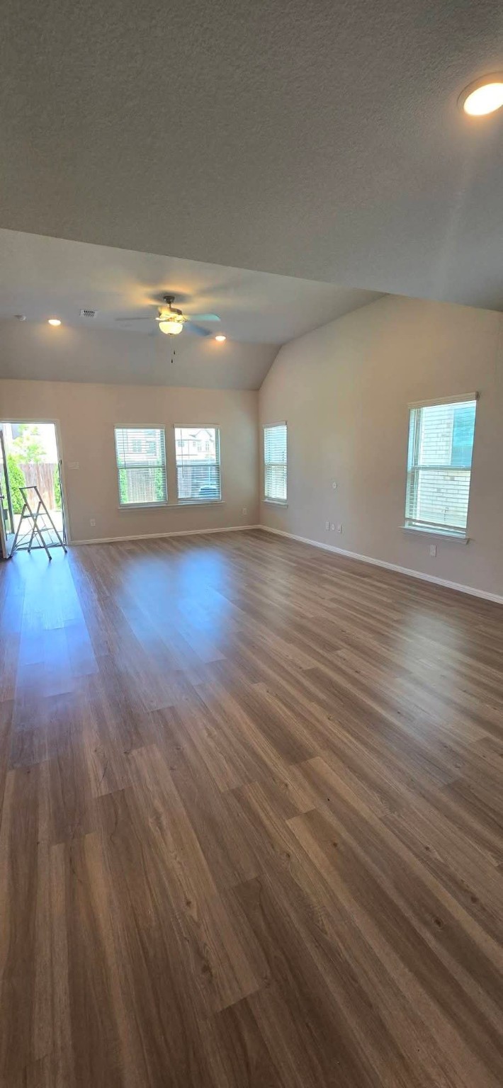 Freshly painted bright living room with vaulted ceiling